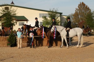 The 2013 ANRC National Intercollegiate Equitation Championship High Point Team from Centenary College of Kelsey Bernini on Pacific,Cori Rech on Gentleman's Way, and Kathryn Haley on Connery 9 (left to right.)
